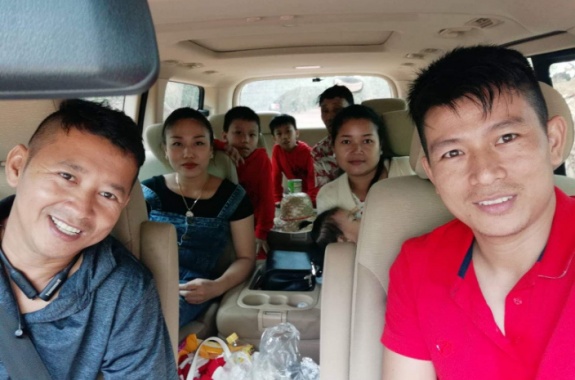 Mr. John with 12 seat Van